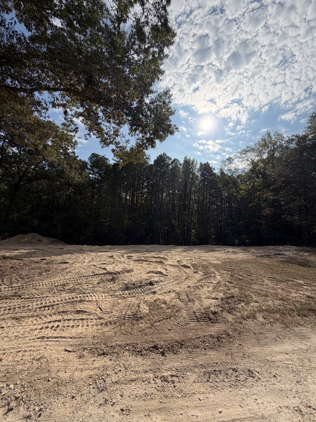 The same Haskell, Arkansas lot after Bratchco finished clearing — smooth graded ground ready to build on
